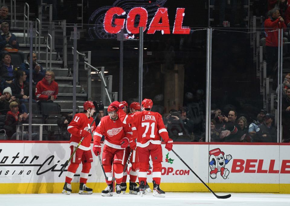 Detroit Red Wings center Robby Fabbri (14) celebrates his goal with teammates during the first period against the Winnipeg Jets at Little Caesars Arena, Dec. 12, 2019, in Detroit.