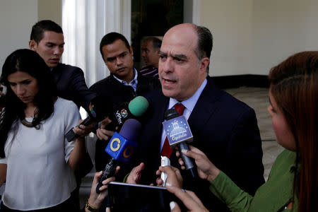 Julio Borges (C), President of the National Assembly and deputy of the Venezuelan coalition of opposition parties (MUD), talks to the media at the National Assembly in Caracas, Venezuela April 5, 2017. REUTERS/Marco Bello