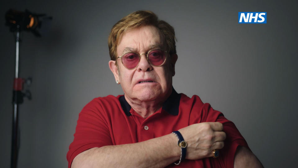 Undated handout screengrab issued by NHS England of Sir Elton John as he stars, with Sir Michael Caine, in the new video to encourage people to get vaccinated against coronavirus. Issue date: Wednesday February 10, 2021.