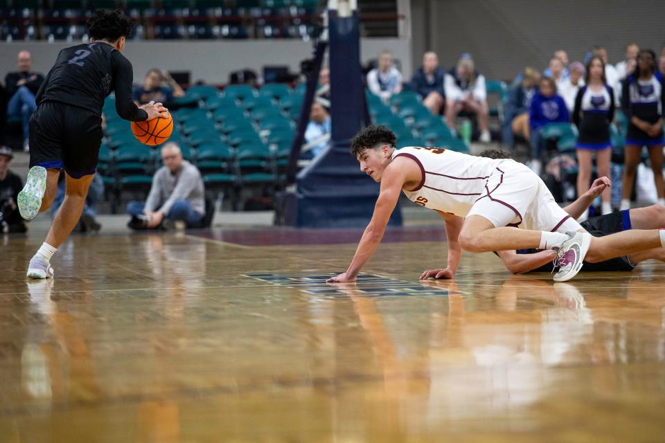 Windsor's Johnathan Reed watches a loose ball get picked up during a class 5A state championship game against Mesa Ridge at the Denver Coliseum on Saturday.