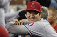 Los Angeles Angels' Shohei Ohtani smiles in the dugout during the fifth inning of the team's baseball game against the Los Angeles Dodgers on Friday, Aug. 6, 2021, in Los Angeles. (AP Photo/Marcio Jose Sanchez)