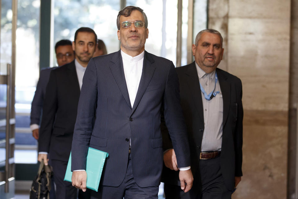 Iran's Deputy Foreign Minister Hossein Jaber Ansari, centre, arrives for consultations on Syria, at the European headquarters of the United Nations in Geneva, Switzerland, Tuesday, Sept. 11, 2018. Representatives of Russia, Turkey and Iran, meet with the UN Special Envoy of the Secretary-General for Syria to discuss the situation in Syria. (Salvatore Di Nolfi/Keystone via AP)