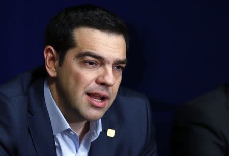 Greece's Prime Minister Alexis Tsipras addresses a news conference after a European Union leaders summit in Brussels February 12, 2015. REUTERS/Francois Lenoir