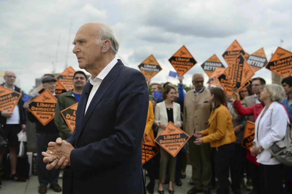 Liberal Democrats leader Sir Vince Cable talks to activists as they celebrate the best ever European Election result in the party's history in central London, Monday, May 27, 2019. With results announced Monday for all regions in the U.K. except Northern Ireland, the Brexit Party had won 29 of the 73 British EU seats up for grabs and almost a third of the votes. On the pro-EU side, the Liberal Democrats took 20% of the vote and 16 seats _ a dramatic increase from the single seat in won in the last EU election in 2014. (Kirsty O'Connor/PA via AP)