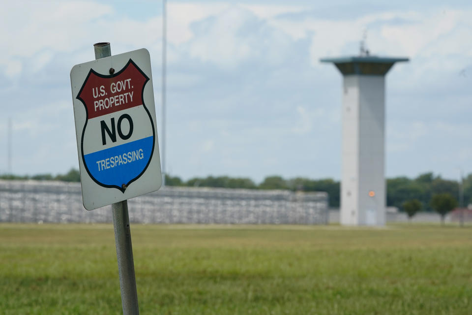 In this Aug. 28, 2020, file photo, a no trespassing sign is displayed outside the federal prison complex in Terre Haute, Ind. A newly released report says the U.S. government for the first time has carried out more civil executions in a year than all states combined as President Donald Trump oversaw a resumption of federal executions after a 17-year pause. (AP Photo/Michael Conroy, File)