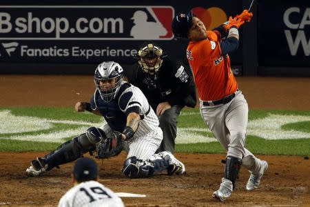 Houston Astros first baseman Yuli Gurriel (10) strikes out during the fourth inning against the New York Yankees in game five of the 2017 ALCS playoff baseball series at Yankee Stadium, Bronx, NY, USA, October 18, 2017. Mandatory Credit: Adam Hunger-USA TODAY Sports