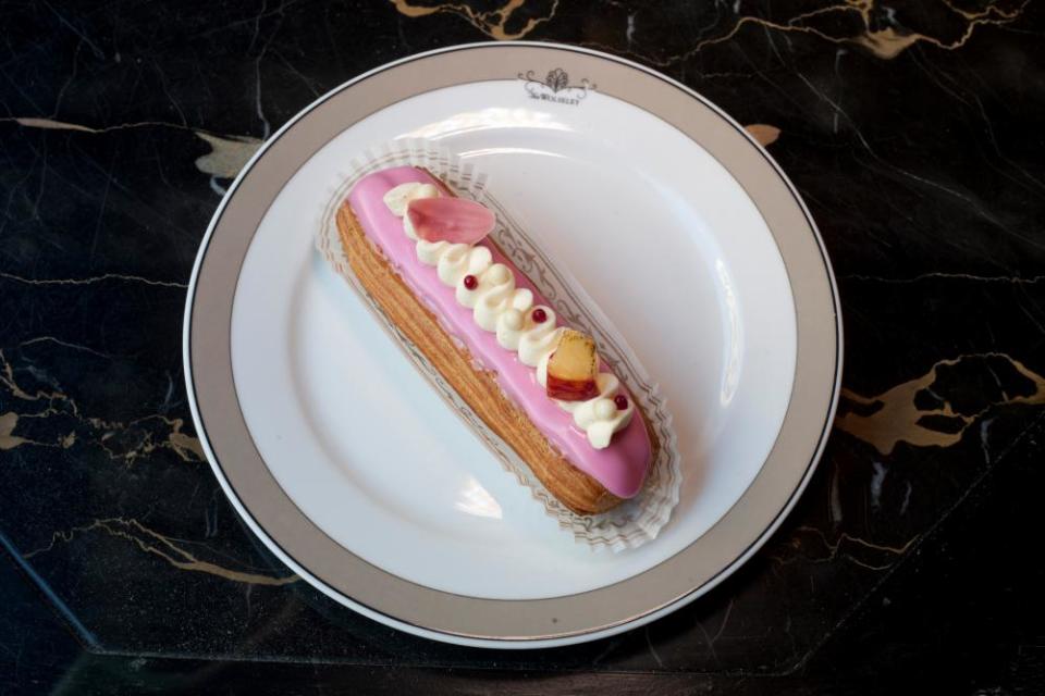 Peach melba éclair – a majestic puff of choux stuffed with peach crème diplomat and raspberries