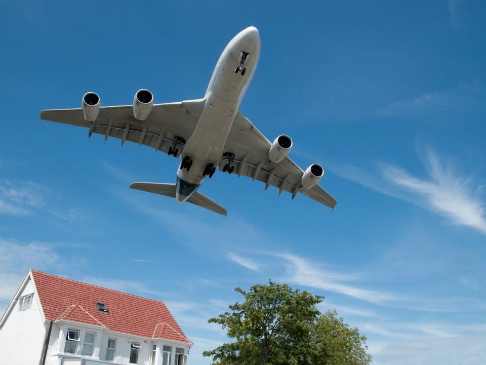 Airplane flying over home