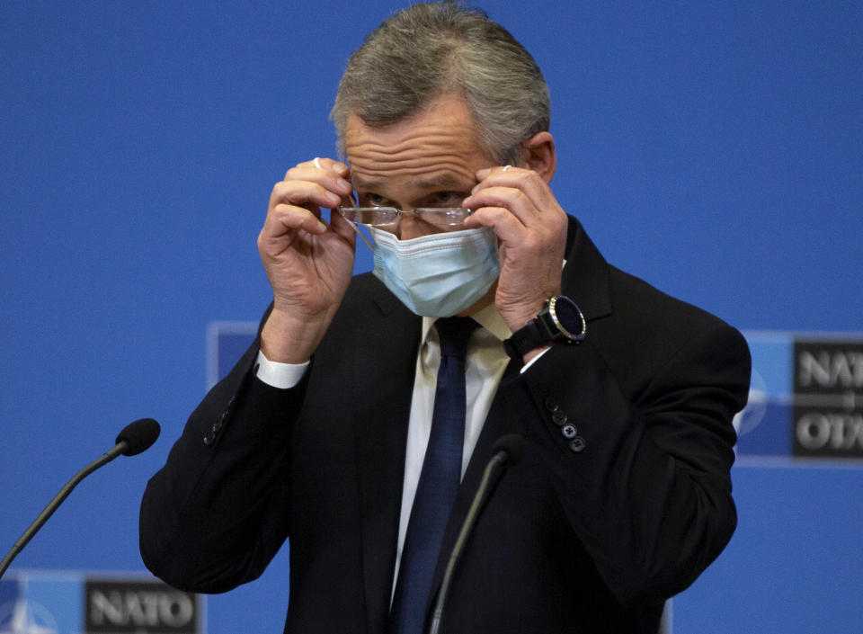 NATO Secretary General Jens Stoltenberg wears a protective face mask as he prepares to address a media conference, after a meeting of NATO defense ministers in video format, at NATO headquarters in Brussels on Thursday, Feb. 18, 2021. (AP Photo/Virginia Mayo, Pool)