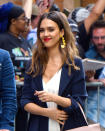 <p>The Honest Company founder and actress was photographed outside the ABC studio in New York City wearing her signature beachy waves, bronzey makeup, and poppy red lipstick. (Photo: Robert Kamau/GC Images) </p>