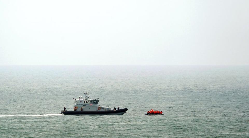 A Border Force vessel intercepts a group of people thought to be migrants in a small boat off the coast of Dover in Kent. (Gareth Fuller/PA) (PA Wire)