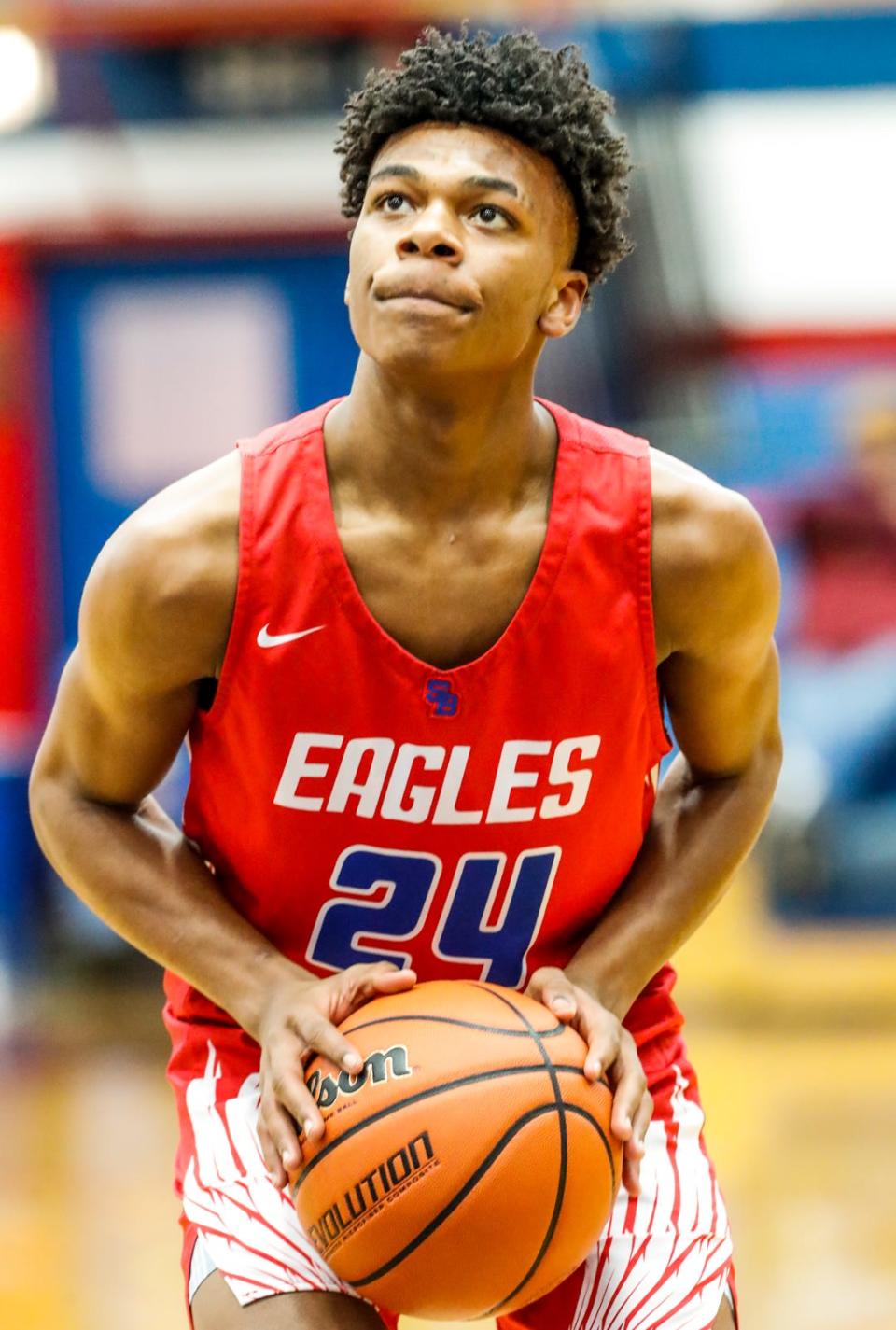 South Bend's Britain Vann (24) shoots a free throw during a game between the Brownsburg Bulldogs and the South Bend Adams Eagles for the Phil Cox Memorial Holiday Tournament on Wednesday, Dec. 29, 2021, at the Memorial Gymnasium in Kokomo Ind. 