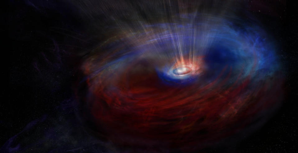 μια μαύρη τρύπα στο διάστημα που περιβάλλεται από πολύχρωμα αέρια