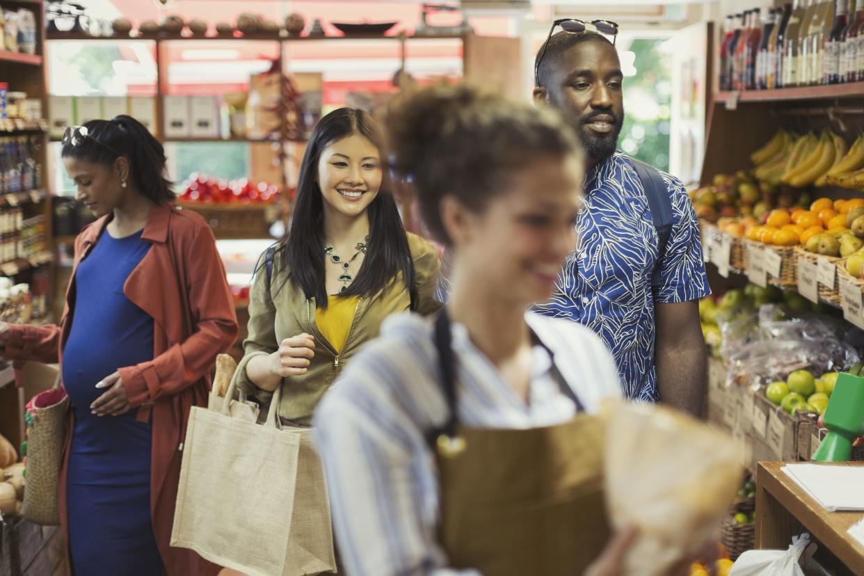 people shopping in grocery store