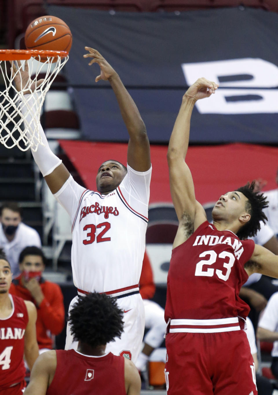 Ohio State forward E.J. Liddell, left, reaches for a rebound against Indiana forward Trayce Jackson-Davis during the second half of an NCAA college basketball game in Columbus, Ohio, Saturday, Feb. 13, 2021. Ohio State won 78-59. (AP Photo/Paul Vernon)