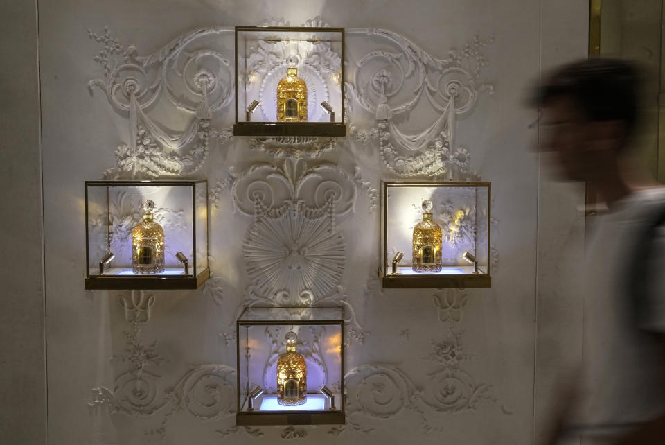 Perfume bottles are displayed as part of the exhibition "Chere Eugenie" at Guerlain's boutique of the Champs-Elysees avenue in Paris, Tuesday, May 30, 2023. Guerlain, the house which invented modern perfumery, has created its first ever archive — and with it has unveiled the unimaginable inventions and fabulous stories that have marked the French company’s sensational past. (AP Photo/Michel Euler)