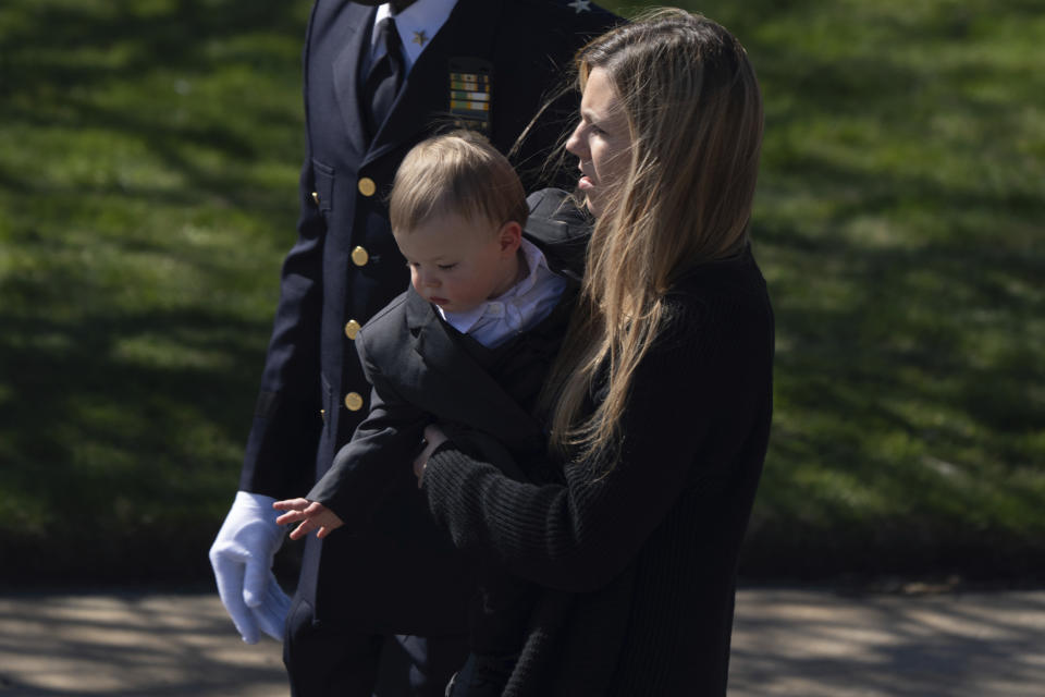 Jonathan Diller 's wife Stephanie Diller and her son arrive during a funeral service for New York City Police Department officer Jonathan Diller at Saint Rose of Lima R.C Church in Massapequa Park, N.Y., on Saturday, March 30, 2024. Diller was shot dead Monday during a traffic stop. He was the first New York City police officer killed in the line of duty in two years.(AP Photo/Jeenah Moon)