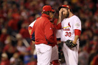 ST LOUIS, MO - OCTOBER 20: Jason Motte #30 of the St. Louis Cardinals reacts after allowing the tying run in the ninth inning and getting removed from the game by manager Tony La Russa during Game Two of the MLB World Series against the Texas Rangers at Busch Stadium on October 20, 2011 in St Louis, Missouri. (Photo by Ezra Shaw/Getty Images)