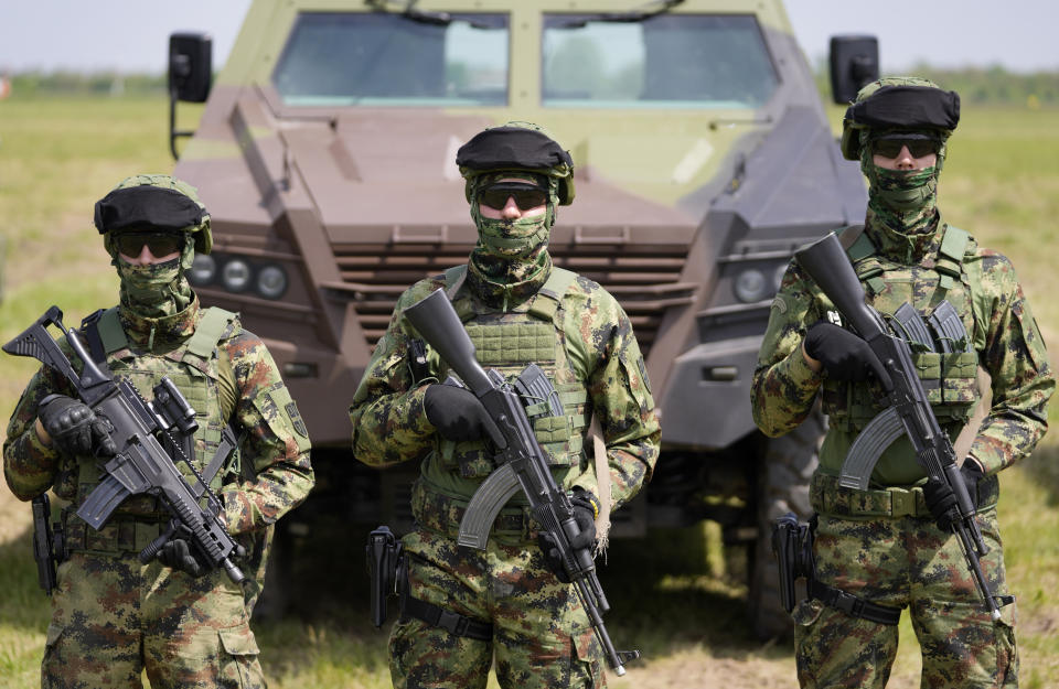 Serbian Army soldiers perform during the military exercises on Batajnica, military airport near Belgrade, Serbia, Saturday, April 30, 2022. Although Serbia officially seeks membership in the European Union, it has been arming itself mostly with Russian and Chinese weapons, including T-72 battle tanks, MiG-29 fighter jets, Mi-35 attack helicopters and drones. (AP Photo/Darko Vojinovic)