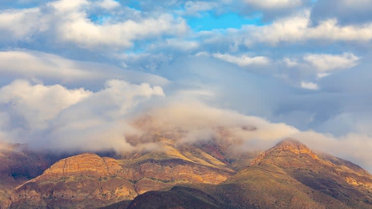 View of the Franklin Mountain Range in El Paso, Texas during a cloudy morning at sunrise.