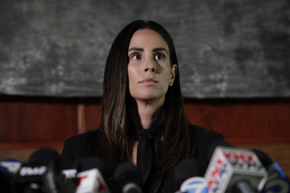 Former sports reporter Kelli Tennant attends a news conference Tuesday, April 23, 2019, in Los Angeles. Tennant filed the suit in Los Angeles County Superior Court on Monday, contending new Sacramento Kings coach Luke Walton assaulted her in a hotel room in Santa Monica while he was an assistant coach for the Golden State Warriors. (AP Photo/Jae C. Hong)