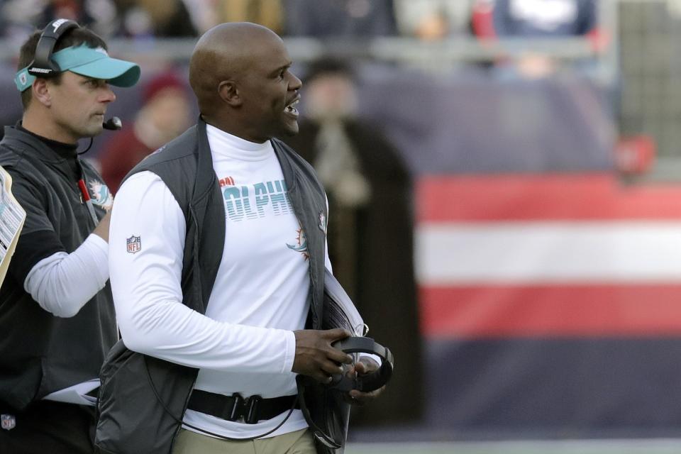 Miami Dolphins head coach Brian Flores works along the sideline in the first half of an NFL football game against the New England Patriots, Sunday, Dec. 29, 2019, in Foxborough, Mass. (AP Photo/Charles Krupa)