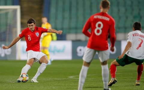 England's Harry Maguire, left, with a pass - Credit: AP Photo/Vadim Ghirda