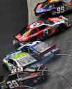 BRISTOL, TN - MARCH 18: Carl Edwards, driver of the #99 Cheez-It Ford, Marcos Ambrose, driver of the #9 Mac Tools Ford, Kasey Kahne, driver of the #5 Farmers Insurance Chevrolet, Kyle Busch, driver of the #18 Wrigley Toyota, and Kevin Harvick, driver of the #29 Budweiser Chevrolet, are involved in an incident during the NASCAR Sprint Cup Series Food City 500 at Bristol Motor Speedway on March 18, 2012 in Bristol, Tennessee. (Photo by Chris Trotman/Getty Images)