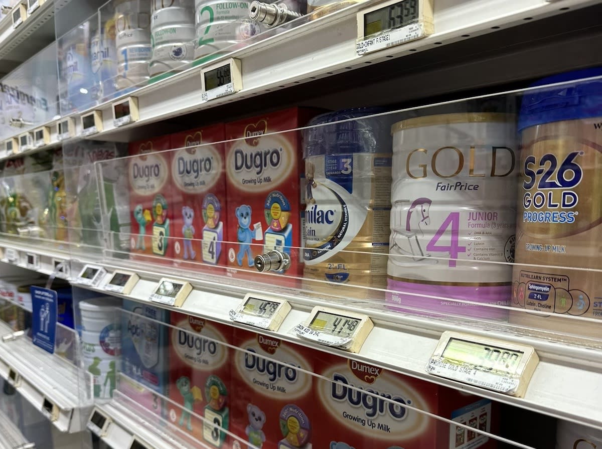 Photo showing plastic screens locked across the aisle with infant formulas at NTUC FairPrice outlet. (PHOTO: Reddit)