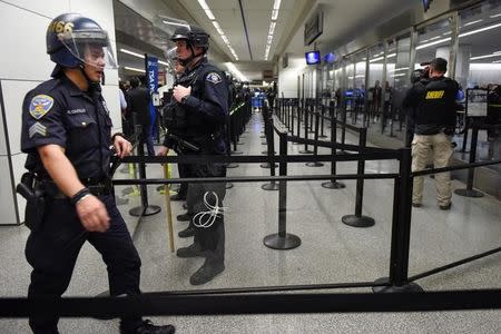 Police block a security check point inside Terminal 4 at San Francisco International Airport in San Francisco, California, U.S., January 28, 2017. REUTERS/Kate Munsch