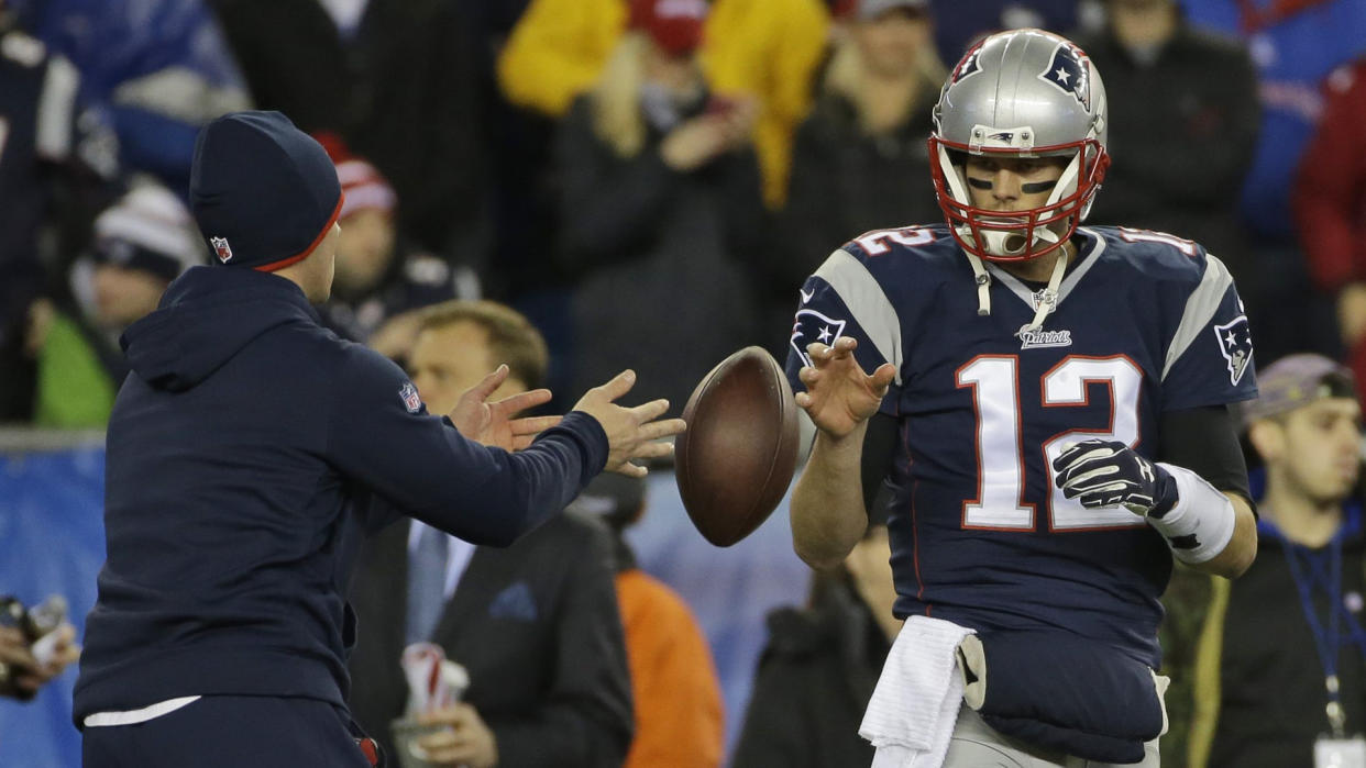 Mandatory Credit: Photo by Matt Slocum/AP/REX/Shutterstock (6015047a)New England Patriots quarterback Tom Brady has a ball tossed to him during warmups before the NFL football AFC Championship game against the Indianapolis Colts in Foxborough, Mass.