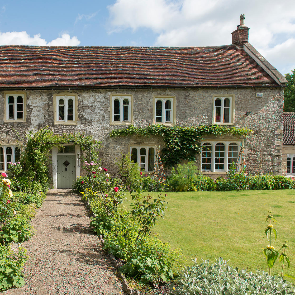  Exterior of a stone listed house in somerset. 