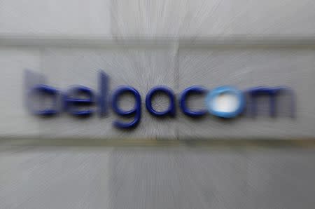 The logo of Belgium's dominant telecom operator Belgacom is seen at the entrance of the company's headquarters ahead of the 2011 half-year results in Brussels July 29, 2011. REUTERS/Yves Herman