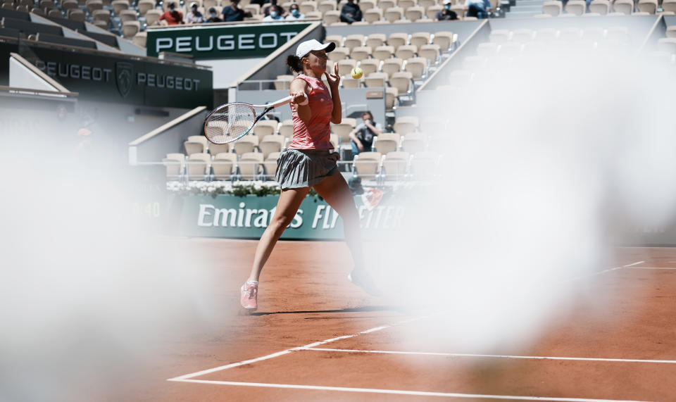 Poland's Iga Swiatek plays a return to Slovenia's Kaja Juvan during their first round match on day two of the French Open tennis tournament at Roland Garros in Paris, France, Monday, May 31, 2021. (AP Photo/Thibault Camus)