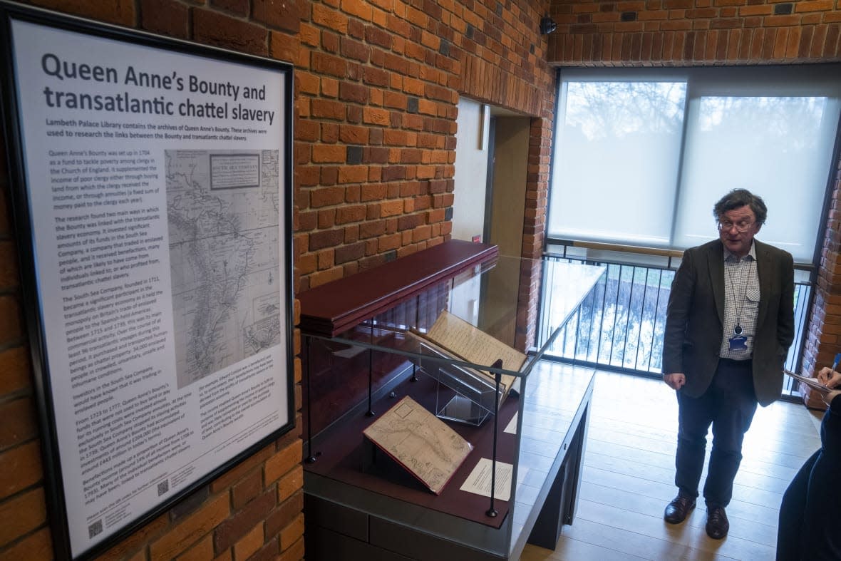 Church archivist Giles Mandelbrote introduces the exhibition of documents exploring the institution’s role in the slave trade, at the Lambeth Palace Library, in London, Tuesday, Jan. 31, 2023. (AP Photo/Kin Cheung)