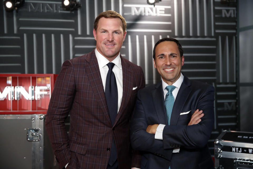 In this Thursday, Aug. 16, 2018, file photo, former NFL player and now analyst Jason Witten, left, and play-by-play commentator Joe Tessitore pose for a photograph before their ESPN telecast of a preseason NFL football game between the Washington Redskins and the New York Jets in Landover, Md. Witten holds one of the most prominent television jobs in the sport as the lead analyst for Monday Night Football." Witten is approaching his new role in similar fashion as he did his old one when his comprehensive film work made him the second most productive tight end in NFL history. (AP Photo/Alex Brandon, File)