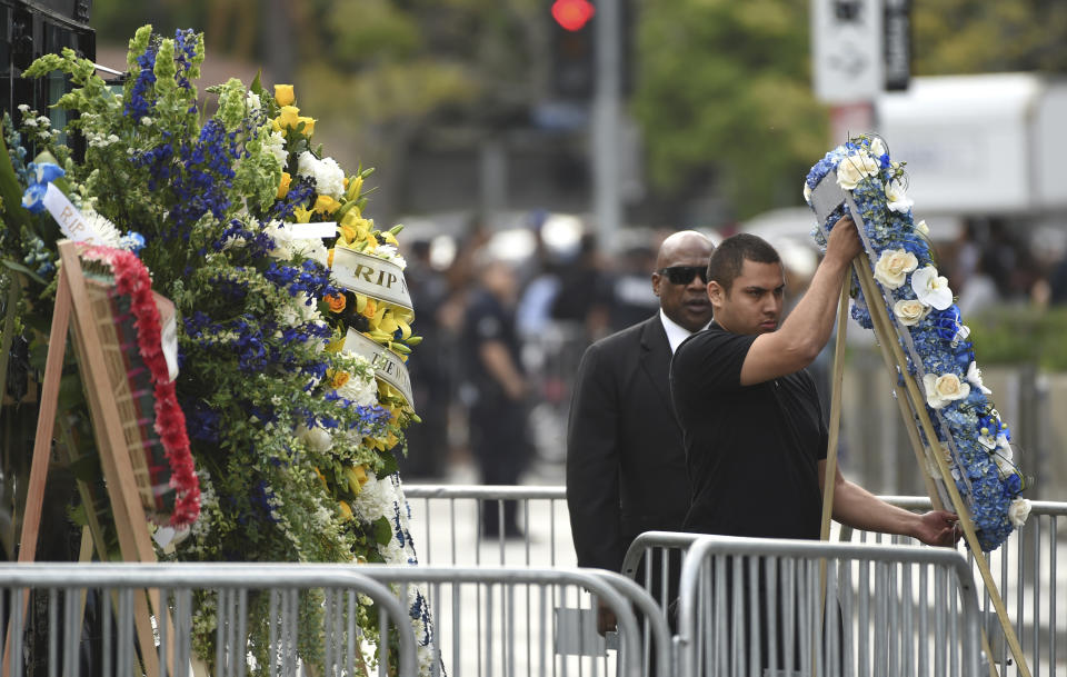 Flowers are placed at the Celebration of Life memorial service for late rapper Nipsey Hussle, whose given name was Ermias Asghedom, on Thursday, April 11, 2019, at the Staples Center in Los Angeles. (Photo by Chris Pizzello/Invision/AP)