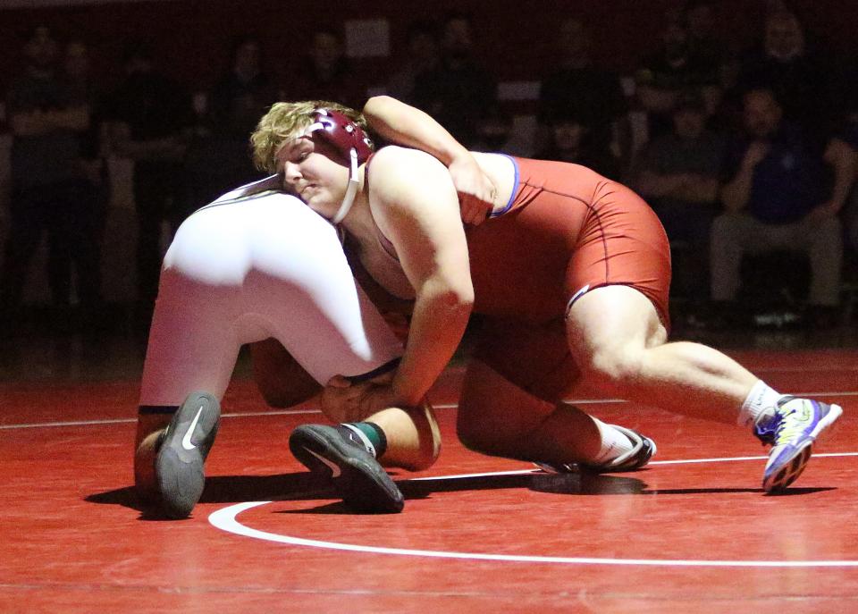 Colton Perkins of Spaulding gets the leg of Essex's Sebastian Coppola during the 285 pound final at the State Championships on Sunday night at CVU.