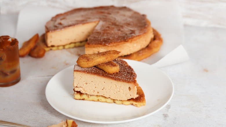 churro cheesecake sliced with dulce de leche