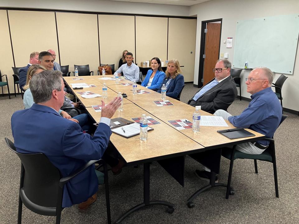 De Pere Mayor James Boyd, left, talks civic engagement and local elections during a Wisconsin Business Leaders for Democracy roundtable Thursday in De Pere.