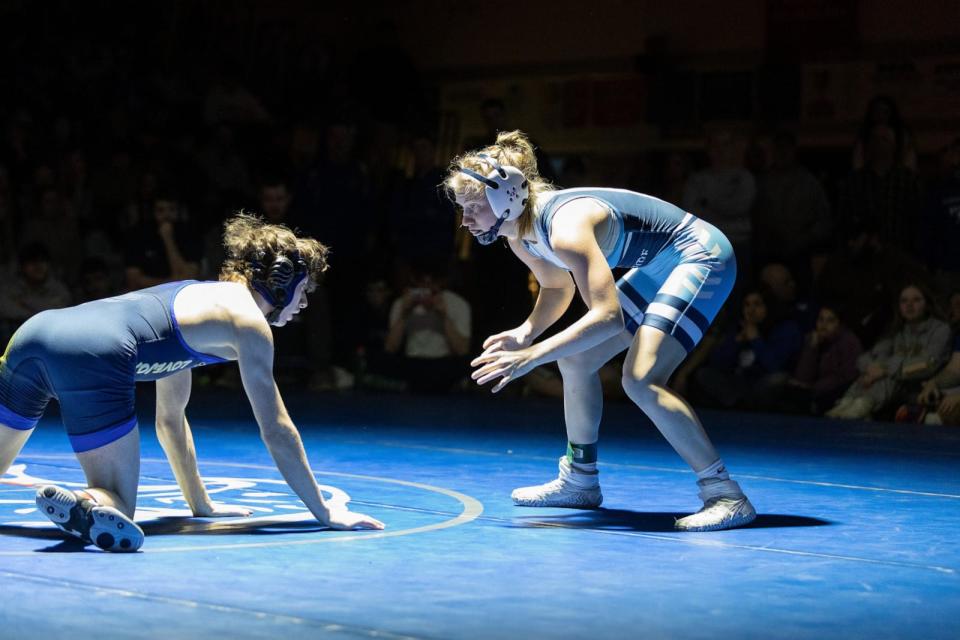 PHOTO: Maddie Ripley, 17, of Oceanside High School in Maine takes the mat on Feb. 17, 2024, in her Class B high school championship match against a male opponent from Belfast Area High School. (Amy Murphy Photography)