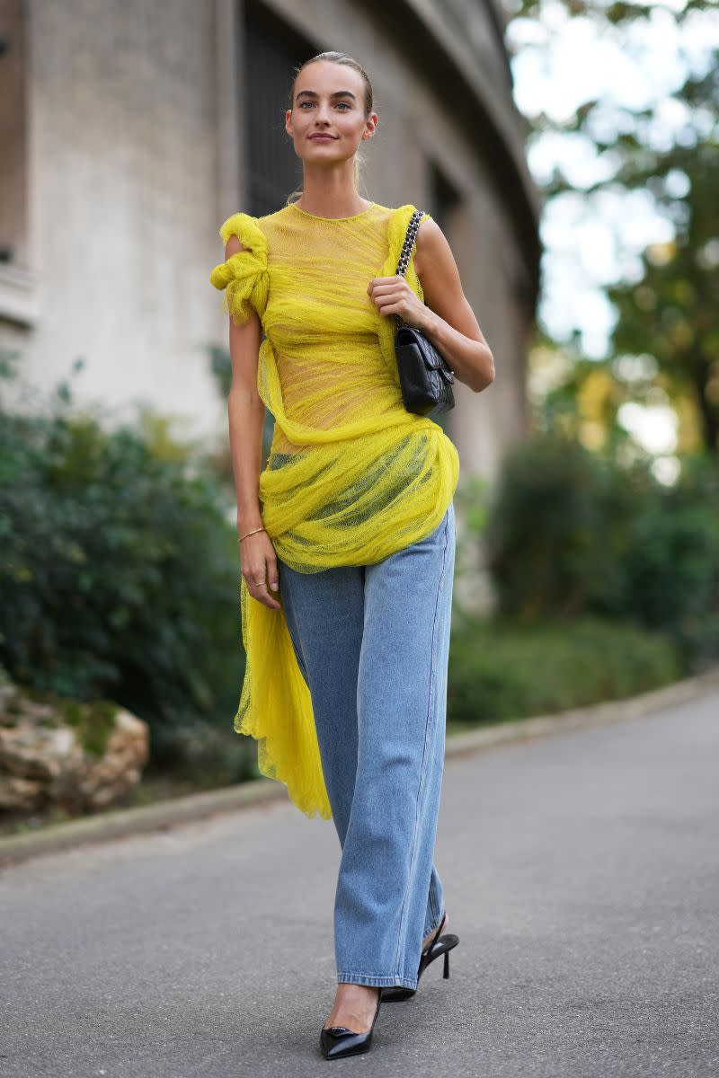 <p> Jeans and a nice top is a look that is always in fashion, especially when party season rolls around. For a modern take on the trend, pair a sheer top like this one with wide leg jeans and minimal accessories. </p>