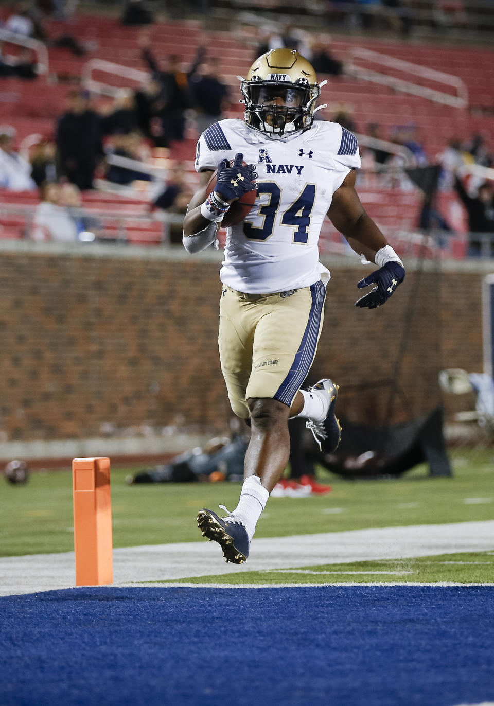 Navy fullback Jamale Carothers scores a touchdown during the second half of the team's NCAA college football game against SMU, Saturday, Oct. 31, 2020, in Dallas. (AP Photo/Brandon Wade)