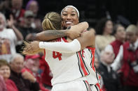 Ohio State's Cotie McMahon, right, and Jace Sheldon, left, celebrate near the end of overtime as Ohio State defeats Iowa in an NCAA college basketball game Sunday, Jan. 21, 2024, in Columbus, Ohio. (AP Photo/Sue Ogrocki)