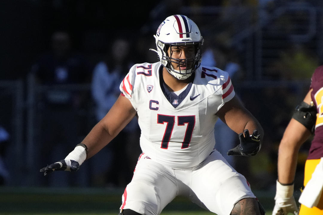 FILE -Arizona offensive lineman Jordan Morgan looks to block during the team's NCAA college football game against Arizona State, Nov. 25, 2023, in Tempe, Ariz. The Green Bay Packers selected Morgan with the 25th overall pick in the NFL draft Thursday. (AP Photo/Rick Scuteri, File)