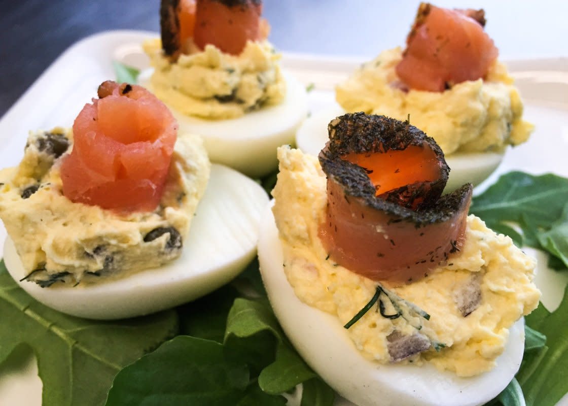 <p>Ben Rayl</p><p>All the elements of a traditional salmon platter are here—the cream cheese, dill, capers and onion—and they combine together flawlessly in these smoked salmon deviled eggs.</p><p><strong>Get the recipe: <a href="https://parade.com/841303/benrayl/smoked-salmon-deviled-eggs/" rel="nofollow noopener" target="_blank" data-ylk="slk:Smoked Salmon Deviled Eggs;elm:context_link;itc:0;sec:content-canvas" class="link rapid-noclick-resp">Smoked Salmon Deviled Eggs</a></strong></p>