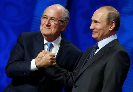 FILE PHOTO: FIFA's President Sepp Blatter shakes hands with Russian President Vladimir Putin (R) during the preliminary draw for the 2018 FIFA World Cup at Konstantin Palace in St. Petersburg, Russia July 25, 2015. REUTERS/Grigory Dukor/File Photo