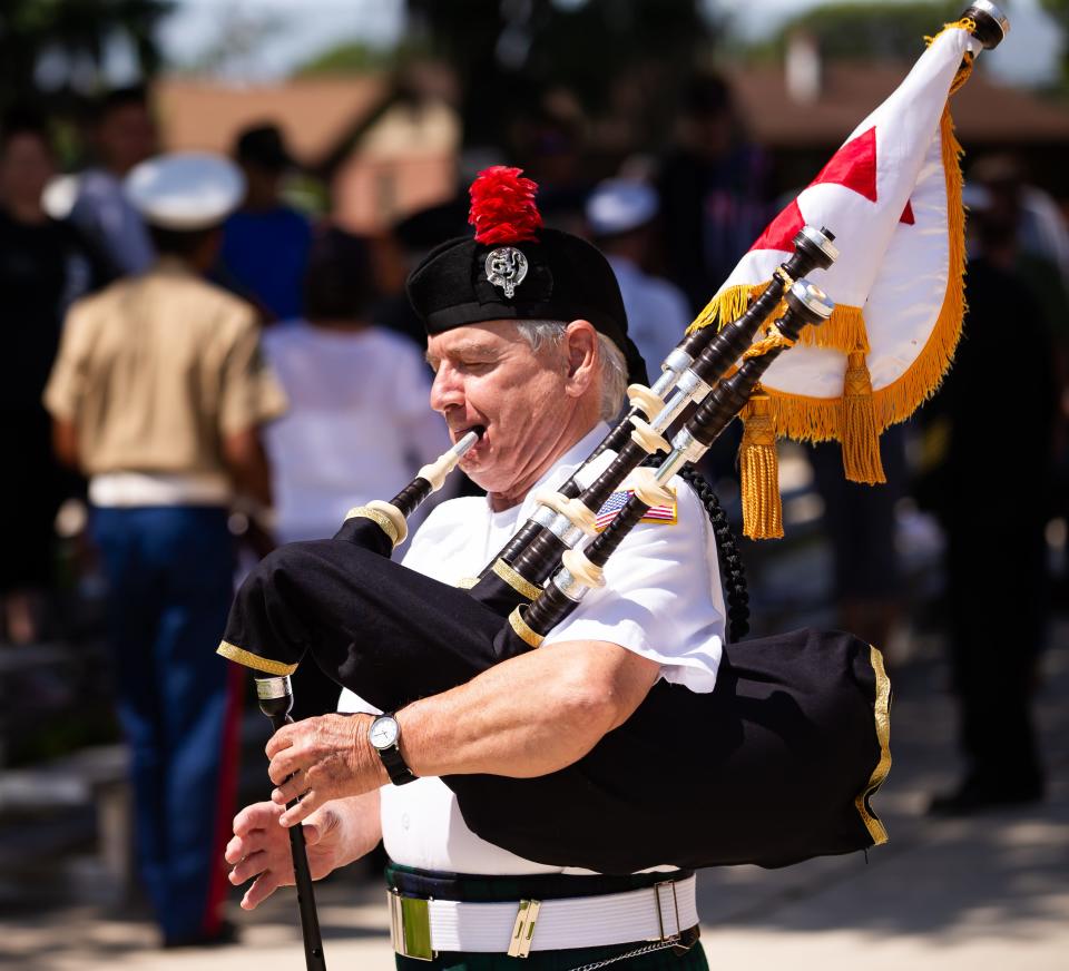 John Earl plays the bagpipes to close out the Memorial Day service as hundreds of people attended the Memorial Day remembrance and honor at the Ocala-Marion County Veterans Memorial Park on Monday. The annual event honors fallen service members that have made the ultimate sacrifice for our country. Live music was provided by the Kingdom of the Sun Concert Band while honoring all branches of the military. [Doug Engle/Ocala Star Banner]2024
(Credit: Doug Engle/Ocala Star-Banner)