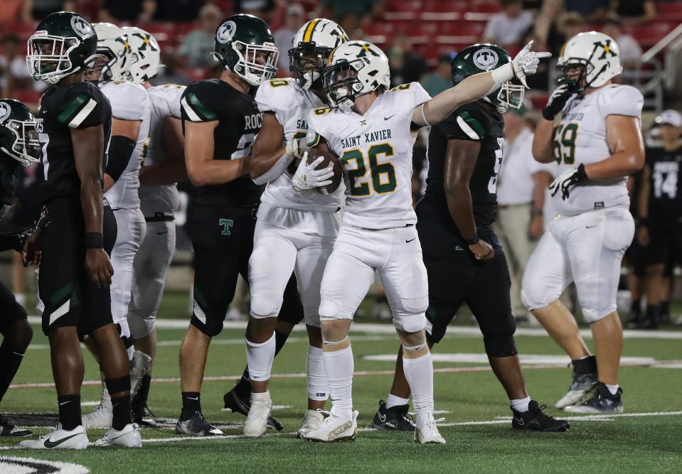 St. X's Davis Yates (26) signals a first down against Trinity during a game at the L&N Stadium in Louisville, Ky. on Sep. 22, 2023.