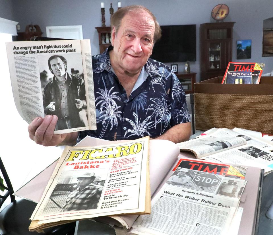 Brian Weber holds an article from one of the many magazines and newspapers that covered his 1970s Supreme Court case. Weber sued his employer and union in Louisiana for reverse discrimination but the decision went against him.